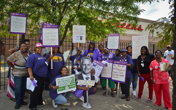 Member boot campers gathered at Walgreens to collect signatures and demand that the corporation pay its fair share.