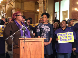 Tamera Cunningham, telephone operator at Touchette Hospital, speaks at our "protect safety net hospitals" in the State Capitol Rotunda Jan. 30th, 2018. Julianna Stratton stands to her right). 