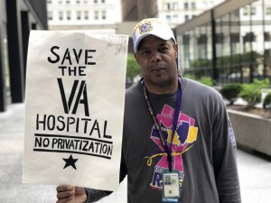 (Reggie Wells, EVS worker at jesse Brown VA for 14 years and veteran who served in the Coast Guard, speaks out against President Trump's "Mission Act" to privatize the VA; May 25, 2018).  