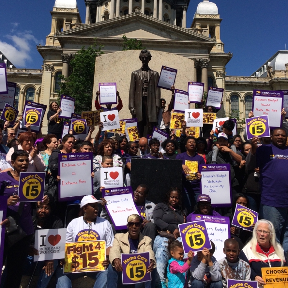 Home care workers and child care providers rally at Lincoln Statue at State Capitol to protest Gov. Rauner's actions to strip away union protections.