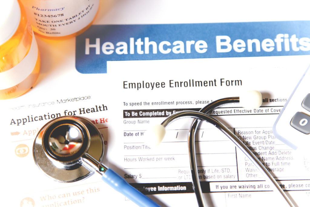 Open enrollment healthcare benefit forms.