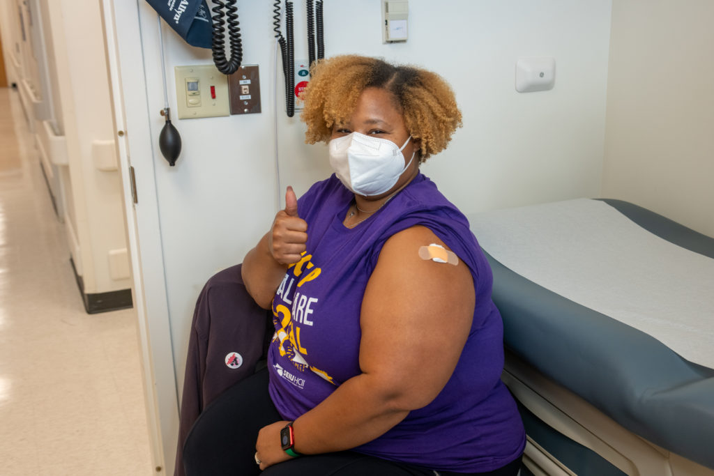 Photos of Erica getting her booster shot at Cook County Hospital 09.27.22